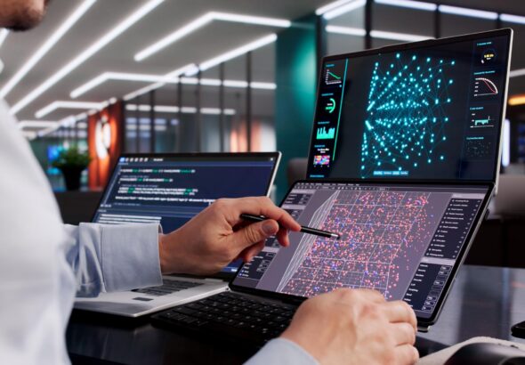 Ilustrasi workstation komputer 2026 dengan multi monitor, setup profesional, dan sistem AI computing berwarna biru futuristik.